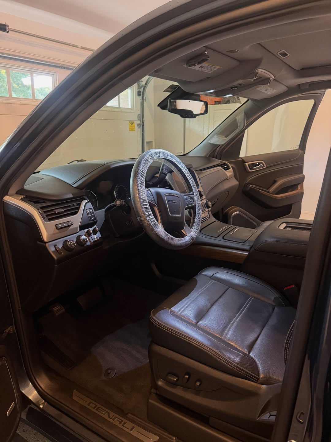 GMC Denali interior with leather seats and wood trim